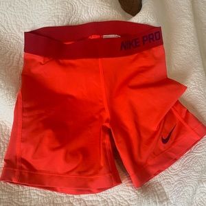 Red/orange Nike Pro shorts